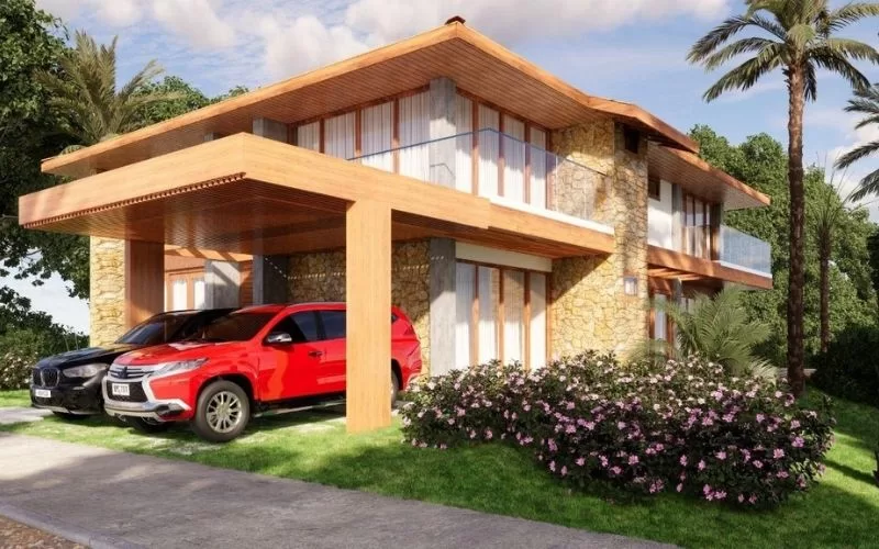 Casa moderna com jardim e carros estacionados.