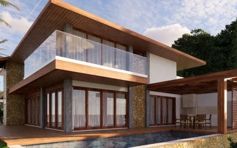 Moradia moderna com piscina e varanda ensolarada.