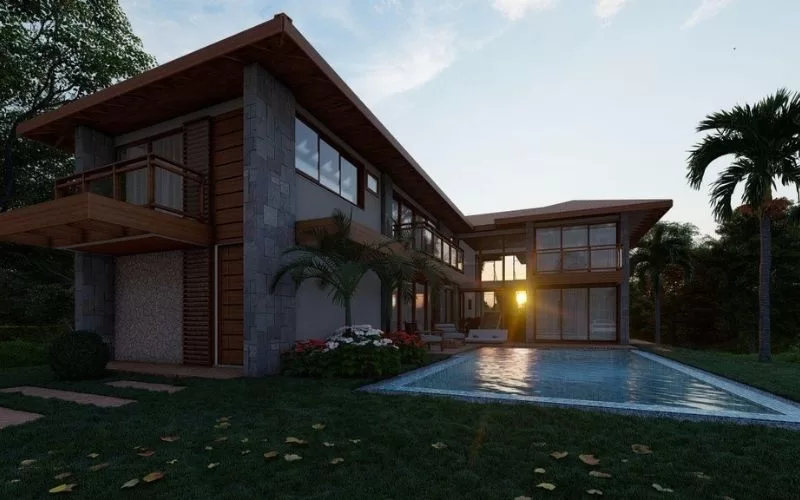 Casa moderna com piscina ao pôr do sol.